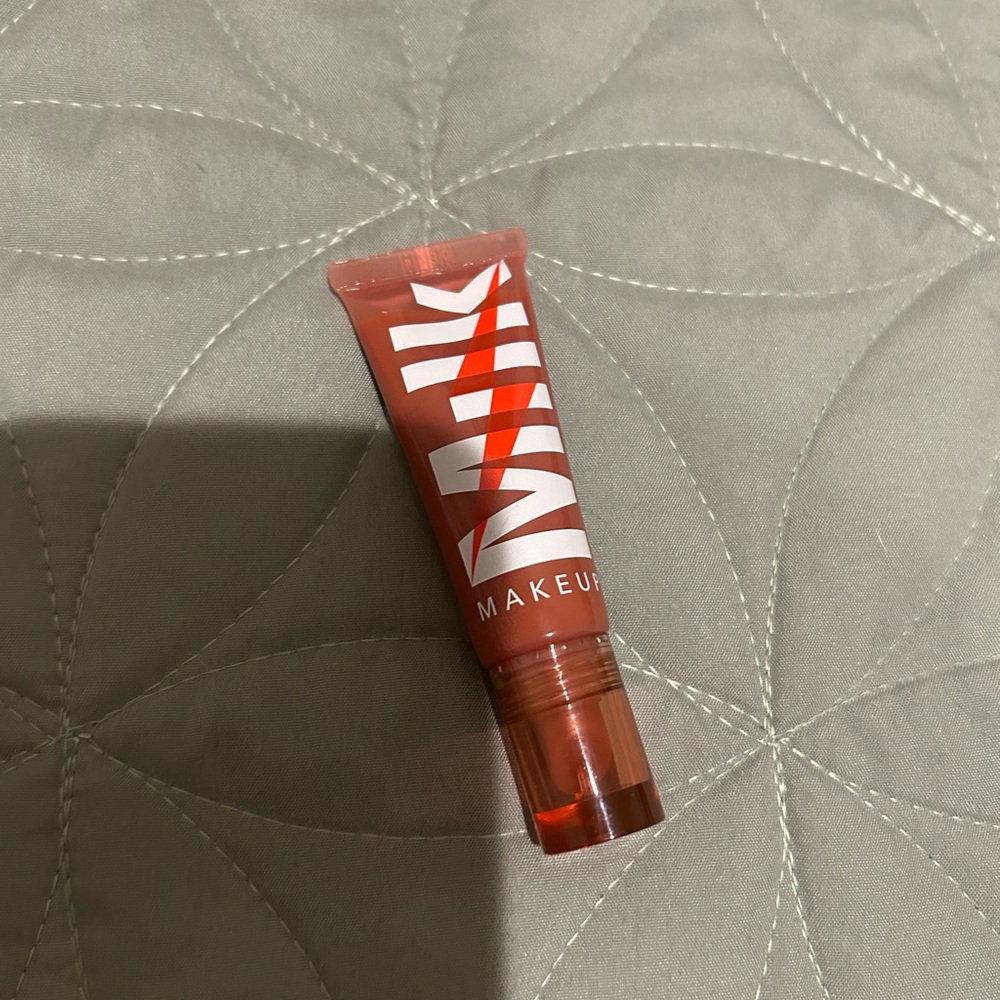 milk makeup lip gloss full size never used in a brownish shade
